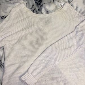 white sweater with knot tie in the back